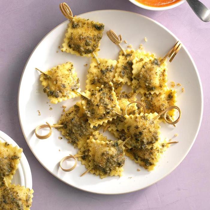 skewered ravioli, arranged on white plate, easy christmas appetizers finger foods, placed on white surface