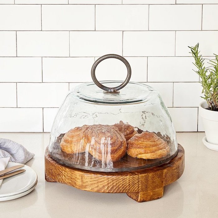 serving board made of salvage wood, large glass lid with metal ring, cinnamon buns inside, christmas gifts for mom