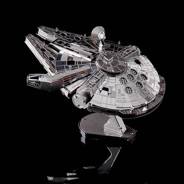 milenium falcon 3d metal puzzle, cute gifts for boyfriend, placed on black surface, black background