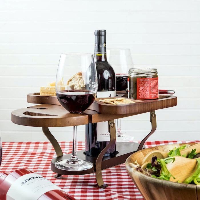 wooden wine caddy, spaces for bottle glasses and cheese and crackers, christmas gifts for mom, placed on the table