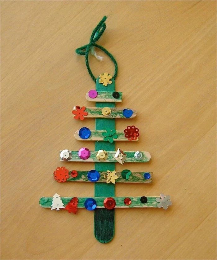 christmas tree made of popsicle sticks, painted in green, christmas ornaments for kids, colorful rhinestones glued to them