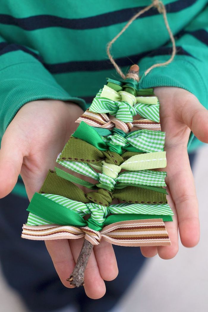 christmas tree ornament, made with a twig and ribbons with different patterns, christmas arts and crafts