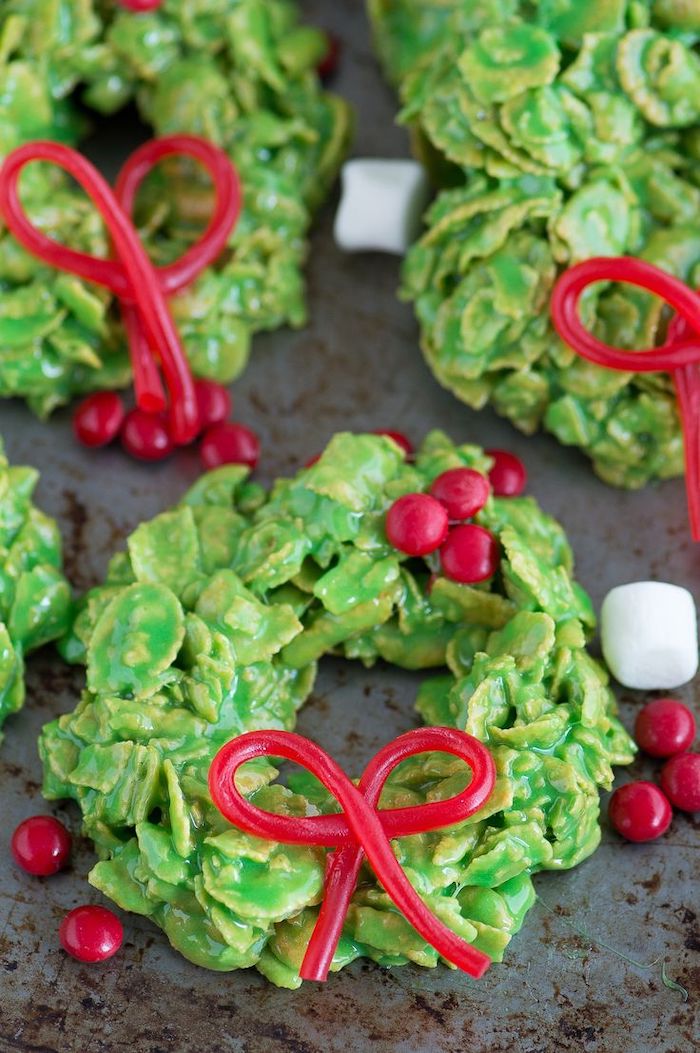 no bake cookies, decorated sugar cookies, wreath shaped cookies, made with oatmeal, placed on grey surface