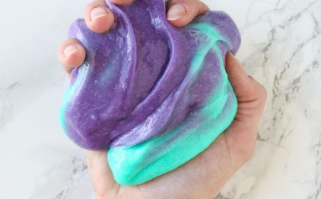 How To Make Slime With Glue 5 Easy Recipes Color Changing Slime In Purple And Turquoise Held In Hand How To Make Slime With Glue Marble Countertop 450x280