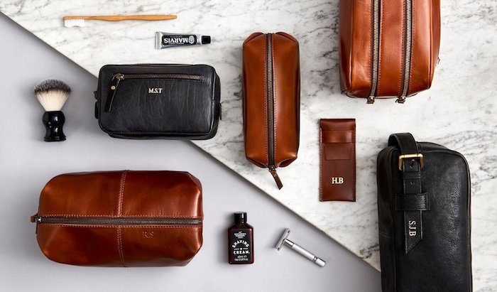 christmas gifts for boyfriend, personalised brown and black leather pouches, shaving tools arranged around them