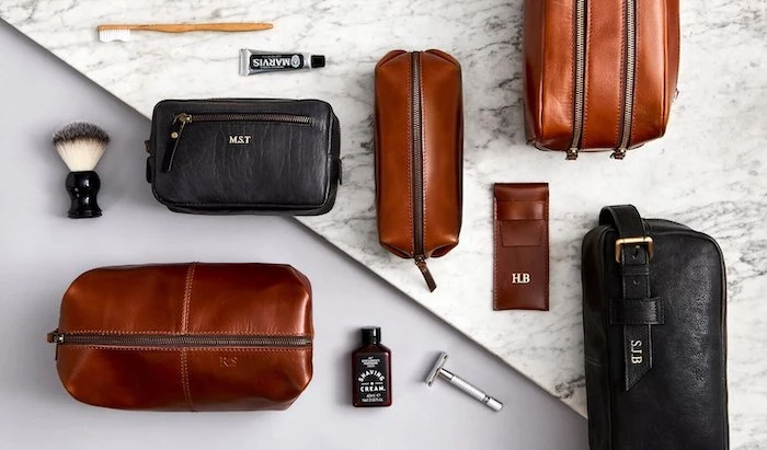 christmas gifts for boyfriend, personalised brown and black leather pouches, shaving tools arranged around them