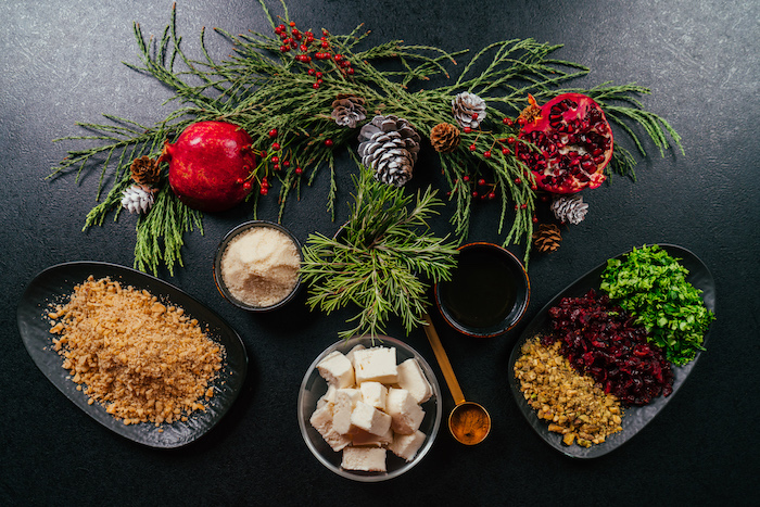 different ingredients in different plates and bowls, arranged on black surface, cream cheese christmas appetizers