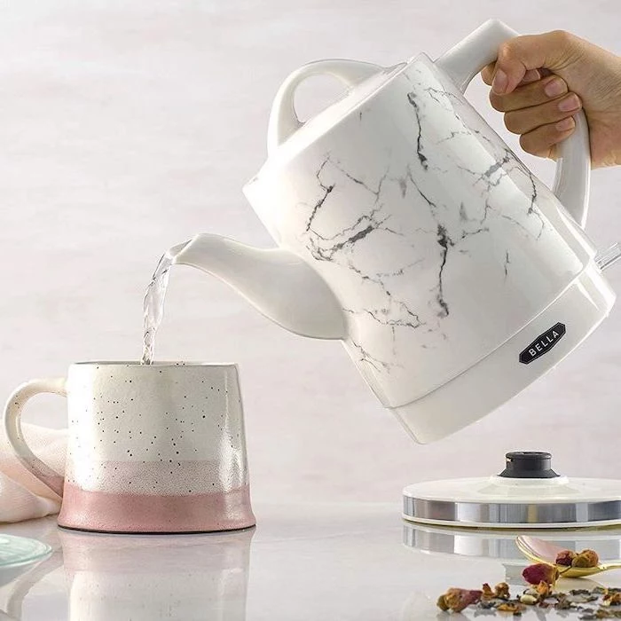 electric tea kettle with marble print, what to get your mom for christmas, pouring water in a ceramic mug