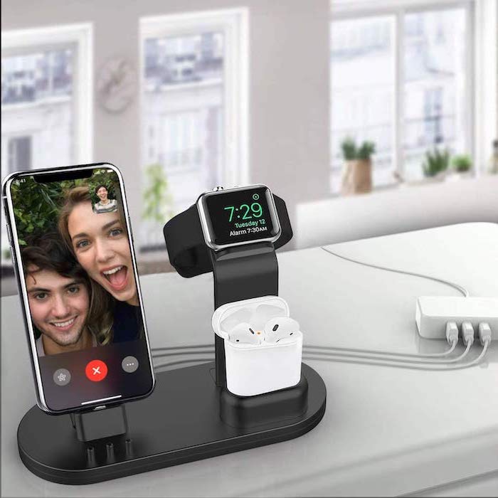 black charging station, iphone watch and air pods charging on it, what to get your boyfriend for christmas, placed on white surface