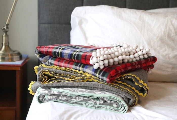 christmas presents for moms, set of three fleece blankets, step by step diy tutorial, arranged on the bed