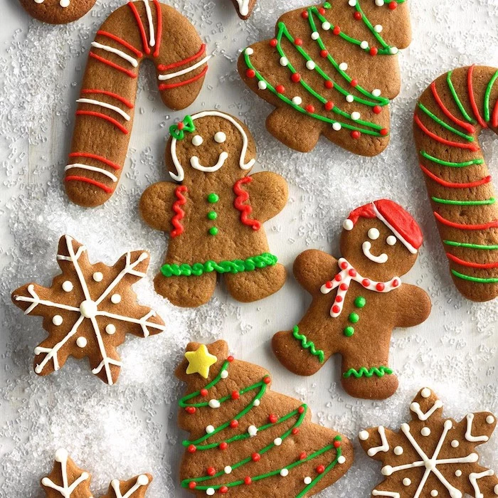 gingerbread men and women, christmas trees and candy canes, snowflake gingerbread cookies, cookie icing