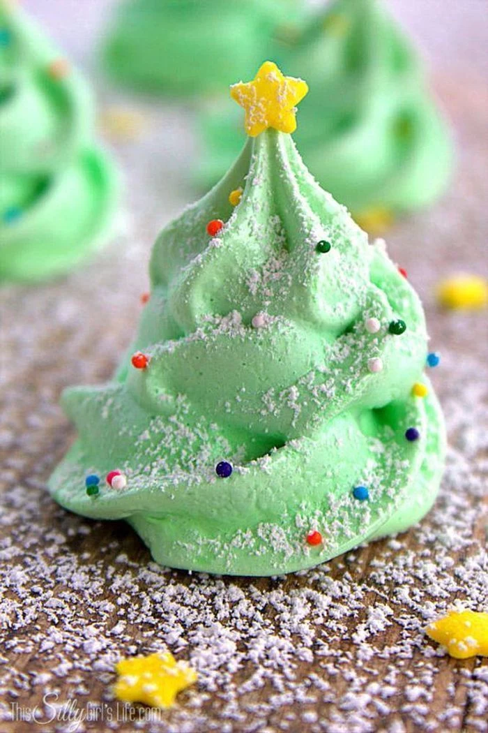 green meringue cookies, in the shape of a christmas tree, gold star on top, how to make icing for cookies, covered with powdered sugar