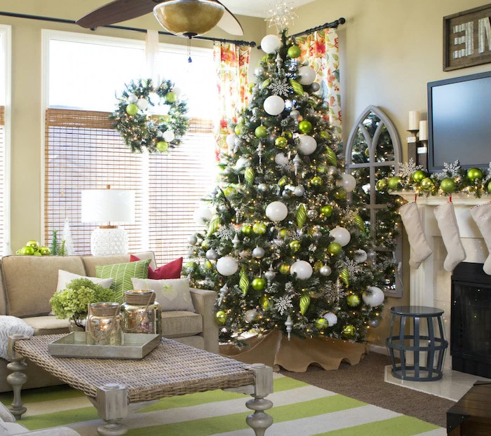 tree placed in the corner, decorated with white silver and green ornaments, rustic christmas tree, placed on wooden floor