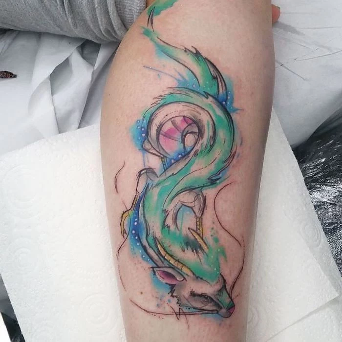 watercolor dragon tattoo, dragon sleeve tattoo, on the side of the leg, leaning on white paper