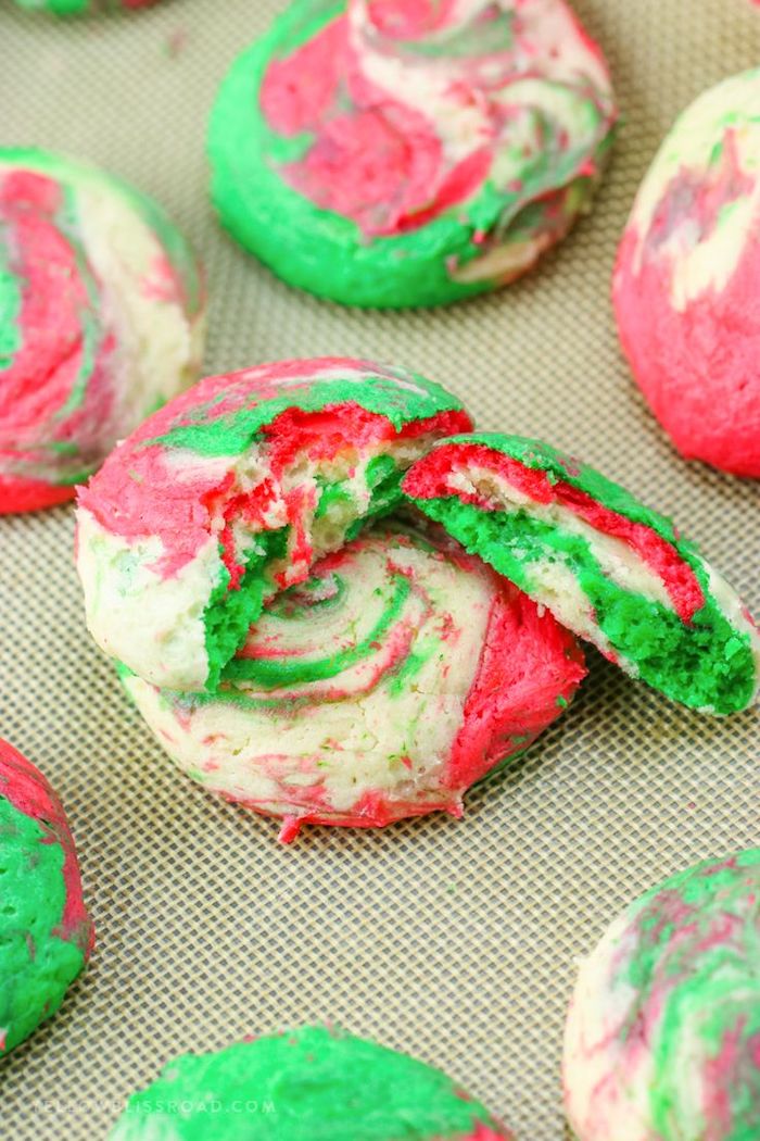cheesecake cookies, made with red and green dough, decorated sugar cookies, one of them split in half