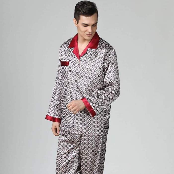 man with black hair, wearing silk pyjamas in white black and red, christmas presents for boyfriend, white background