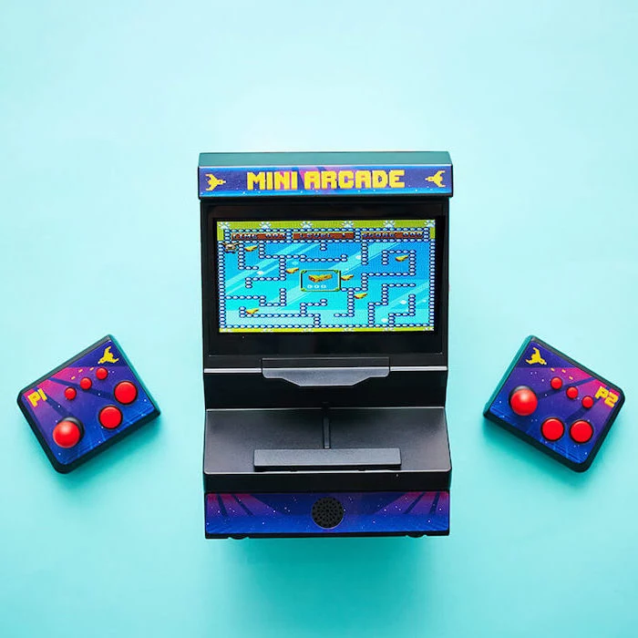 mini arcade game, christmas presents for boyfriend, two joysticks on the side, placed on turquoise surface