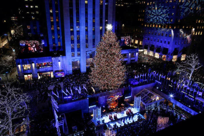 how to decorate a christmas tree, people standing at the lightning ceremony, rockefeller center christmas tree