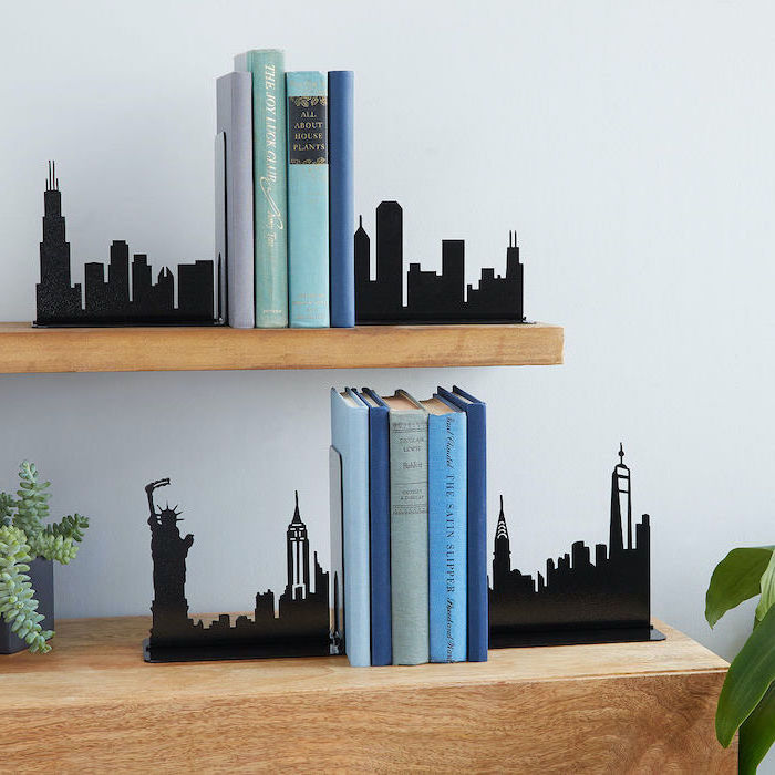 books placed in the middle of bookends, placed on wooden shelves, christmas gifts for mom from daughter, white wall