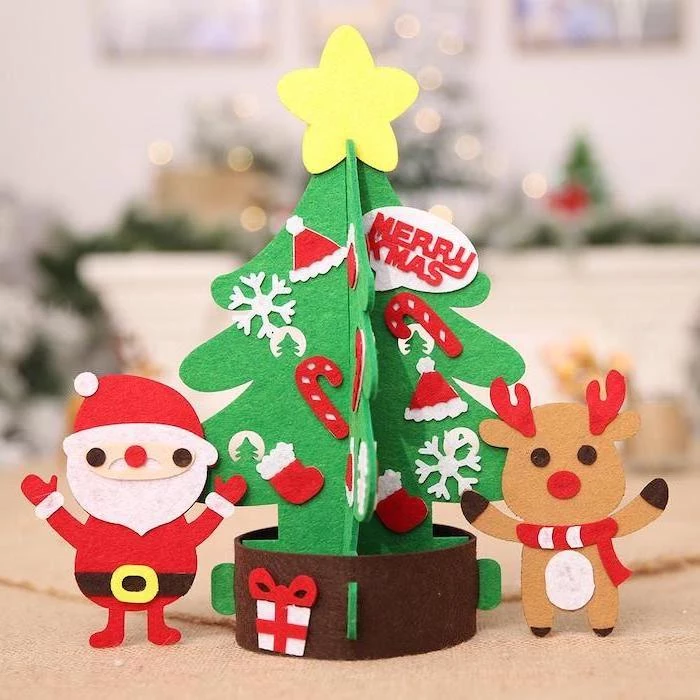 christmas tree santa and reindeer, made of felt, christmas arts and crafts, placed on white surface