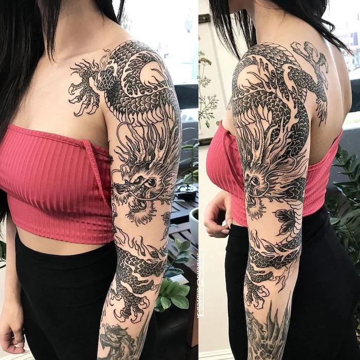 woman wearing red crop top and black pants, large sleeve tattoo of a dragon, dragon tattoos for women, black hair