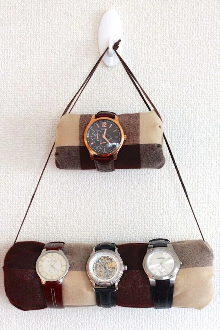watch holder mounted on white wall, step by step diy tutorial, gift ideas for boyfriend, brown leather straps, four watches on it