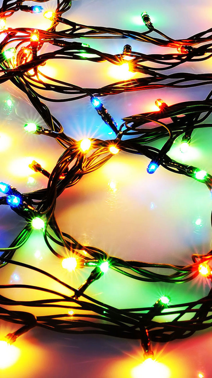 string of colorful lights, placed on white surface, winter wallpaper iphone