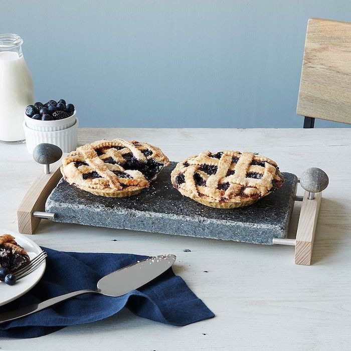 meaningful gifts for mom, serving platter made of stone and wood, two pies on it, placed on wooden table