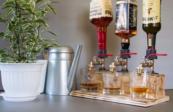 alcohol dispenser with three taps, whiskey bottles mounted on it, thoughtful christmas gifts for boyfriend, made of wood