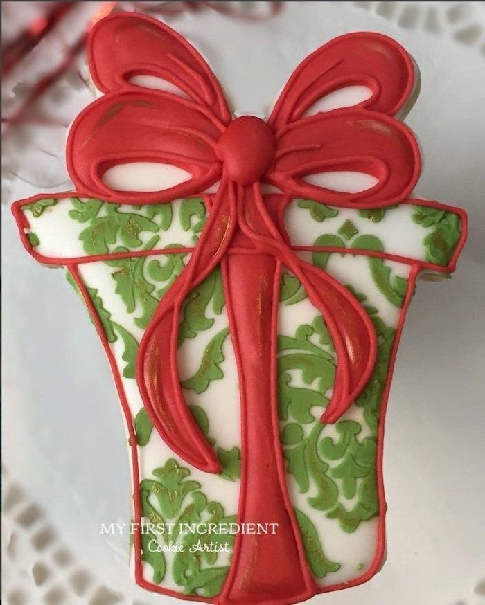 cookie in the shape of a christmas present, royal icing recipe for sugar cookies, decorated with red green and white icing