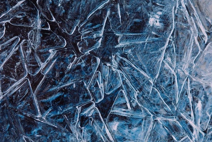 frozen ice water, laptop wallpaper, snowflakes in the ice, dark aesthetic