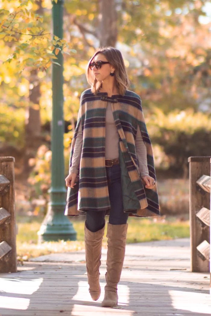 woman walking in a park, wearing jeans and grey sweater, knee high boots and coat, fall styles for women, short blonde hair