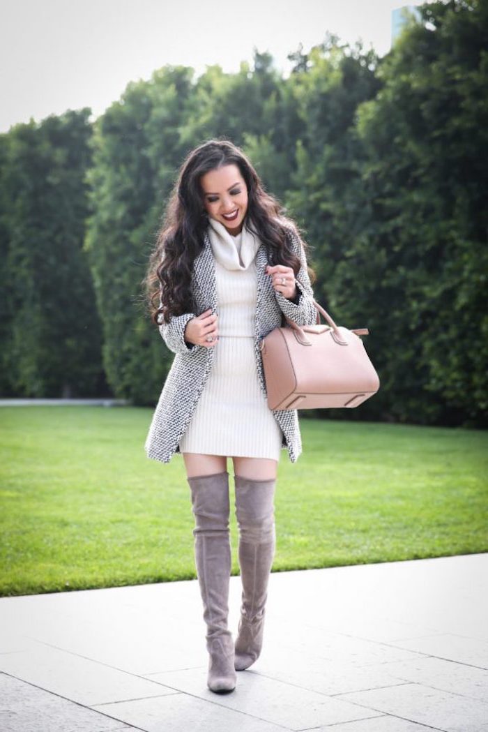 woman wearing white knitted dress, black and white blazer and knee high boots, fall styles for women, beige leather bag