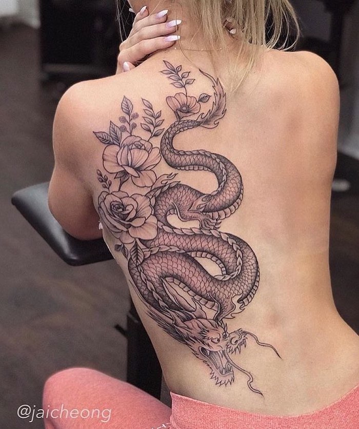 large back tattoo, dragon tattoo ideas, peony flowers intertwined with dragon, woman with blonde hair, pink pants