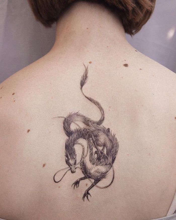 back tattoo, woman with short brown hair, dragon tattoo ideas, white background