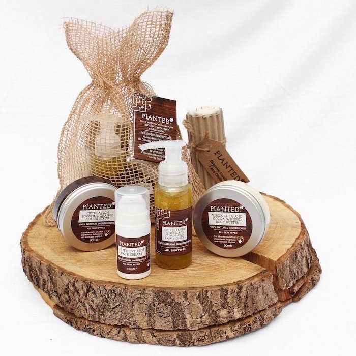 set of skin care products, arranged on wooden log, meaningful gifts for mom, white background