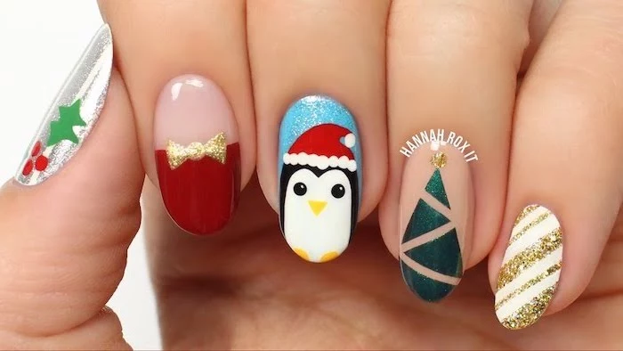 winter nail colors, almond shaped nails, different decorations on each nail, penguin christmas tree and mistletoe