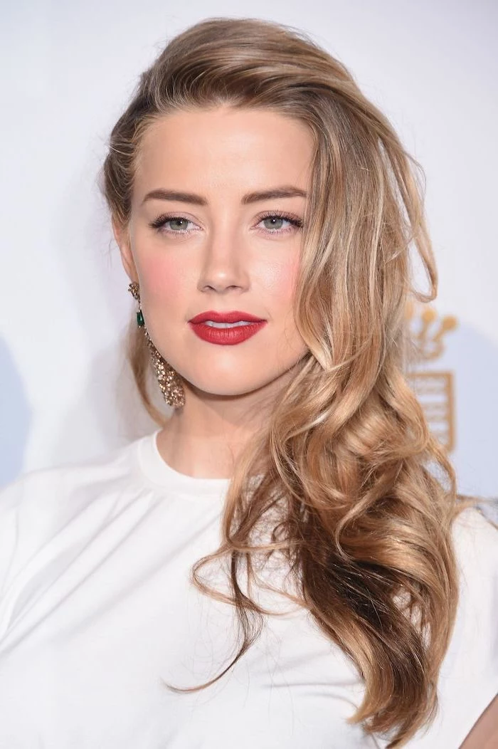 2020 hair color trends for brunettes, amber heard with blonde hair, long wavy hair, wearing white dress