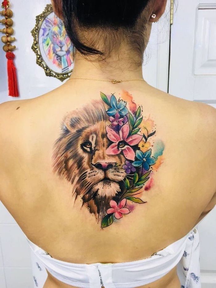 lioness tattoo with flowers
