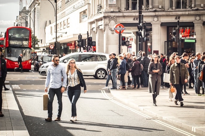 benefits-of-shopping-lots-of-people-walking-up-and-down-oxford-street-oxford-circus benefits of shopping, people walking up and down the street, oxford street london, oxford circus london