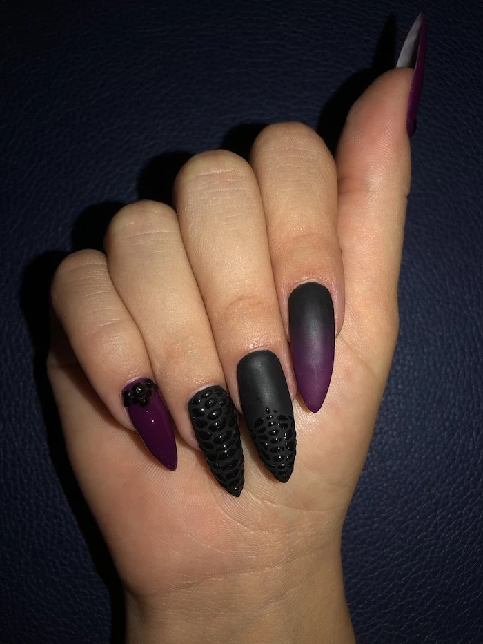 ombre nails, long stiletto nails, black and dark purple gradient nail polish, rhinestones decorations on middle ring and pinky fingers