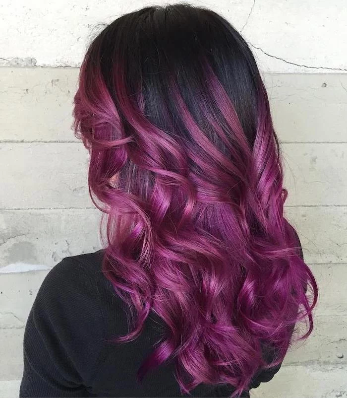 black hair with violet ombre effect, medium length wavy hair, woman wearing black blouse, curly hair color ideas