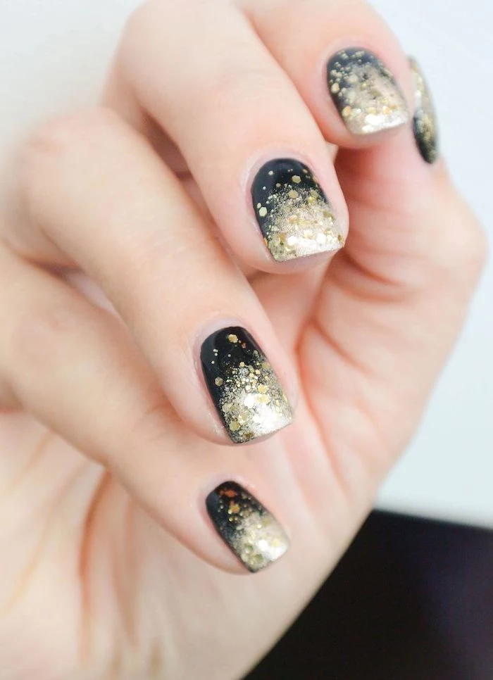 black to gold glitter nail polish, glitter ombre nails, short squoval nails, white background