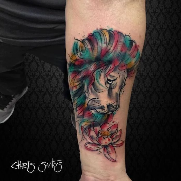 watercolor forearm tattoo, lioness tattoo, profile of lion head, watercolor mane in different colors, watercolor lotus flower