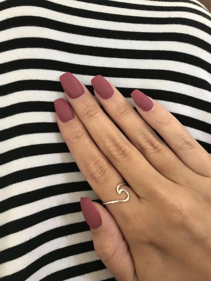 medium length squoval nails, nail color ideas, light purple pink matte nail polish, ring on the index finger