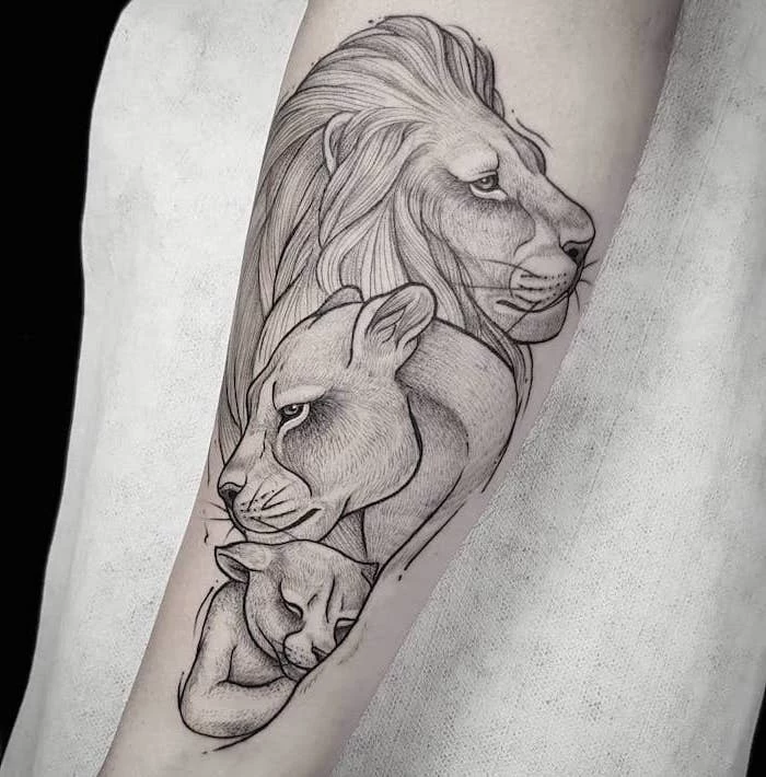 family of lions, lion and lioness with their cub, lion chest tattoo, forearm tattoo, white background