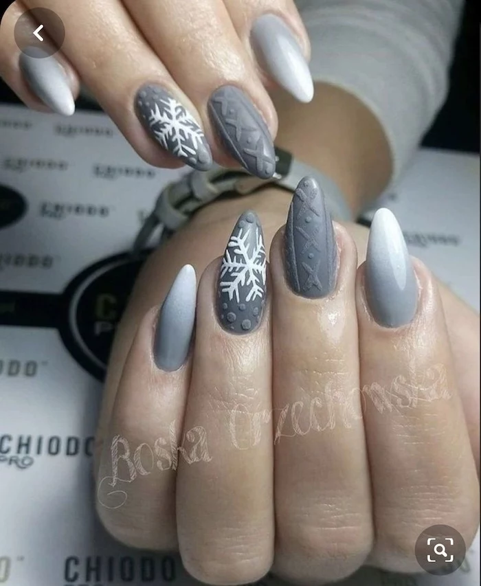 winter nails, medium length stiletto nails, ombre acrylic nails, white to grey gradient nail polish, decorations on ring and middle fingers