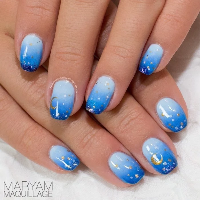 light to dark blue gradient nail polish, pink and white ombre nails, decorations with stars and moon on each finger