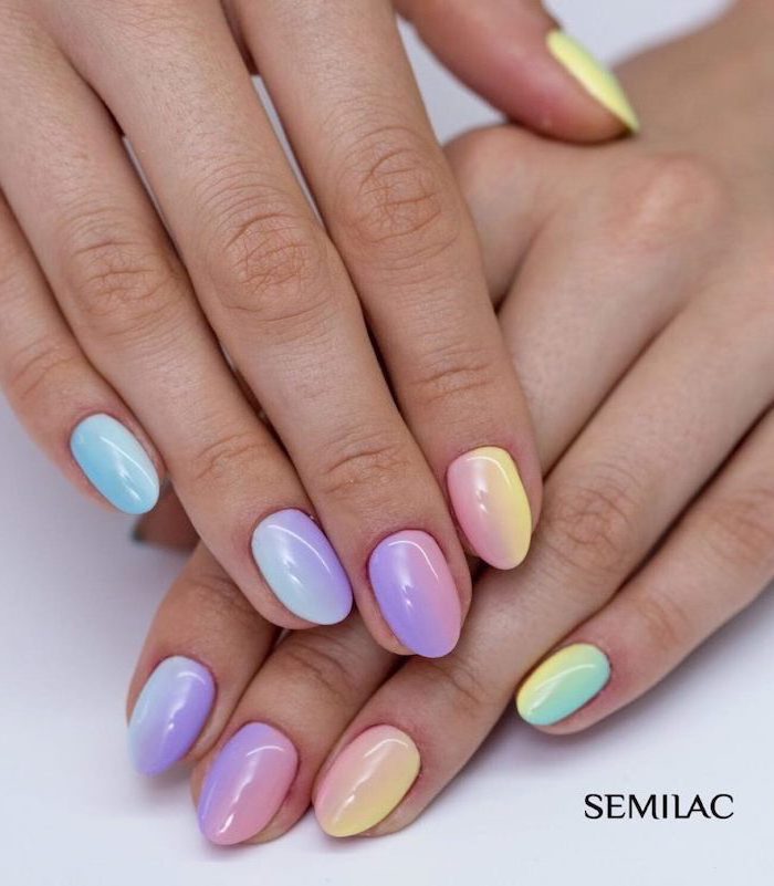 gradient rainbow colors, different shades on each nail, pink ombre nails, from yellow to blue on almond nails
