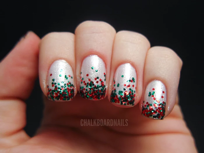 white glitter nail polish, pretty nail colors, short squoval nails, green and red glitter decoration on each nail